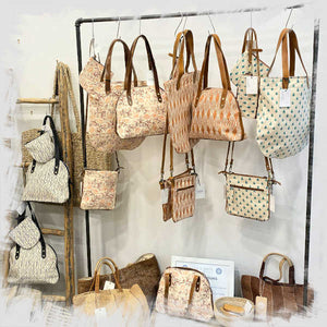 Collection of handmade bags displayed in store