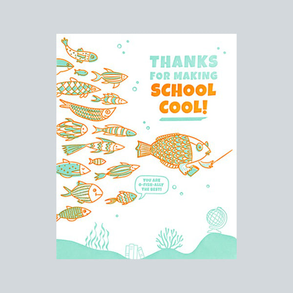Handprinted fair trade card depicting a school of fish in orange and aqua colours and the message "Thanks for making school cool"
