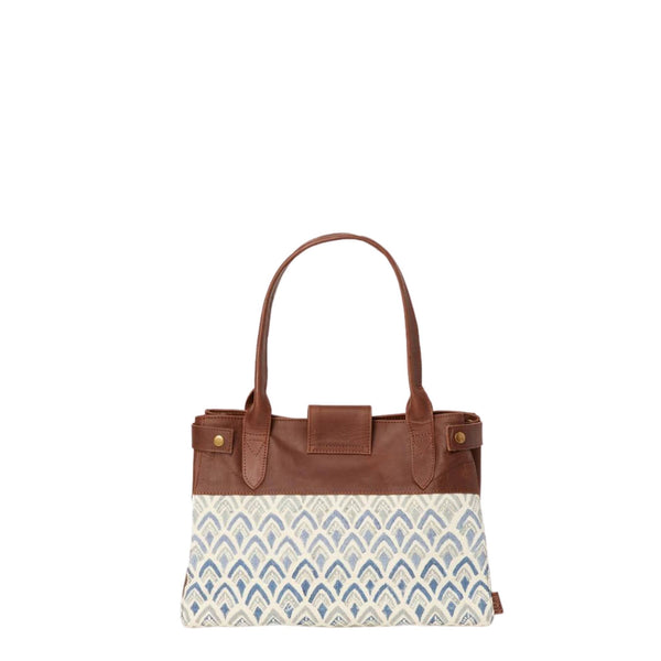 Handbag with hand-blockprinted cotton with blue print and brown leather exterior with paddle handles and expandable side straps