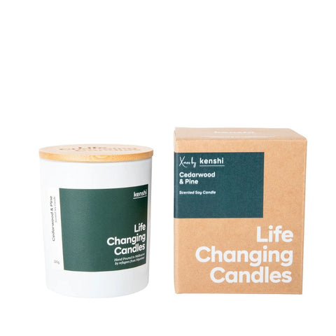 Candle with wooden lid and packaging labeled 'Life Changing Candles' by kenshi on a white background