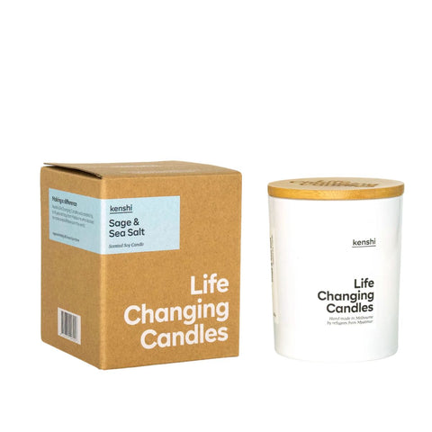 Kenshi 'Life Changing Candles' packaging with a cardboard box and white candle.