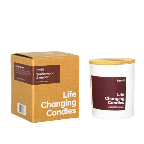 Life Changing Candles sandalwood and amber candle with packaging on a white background