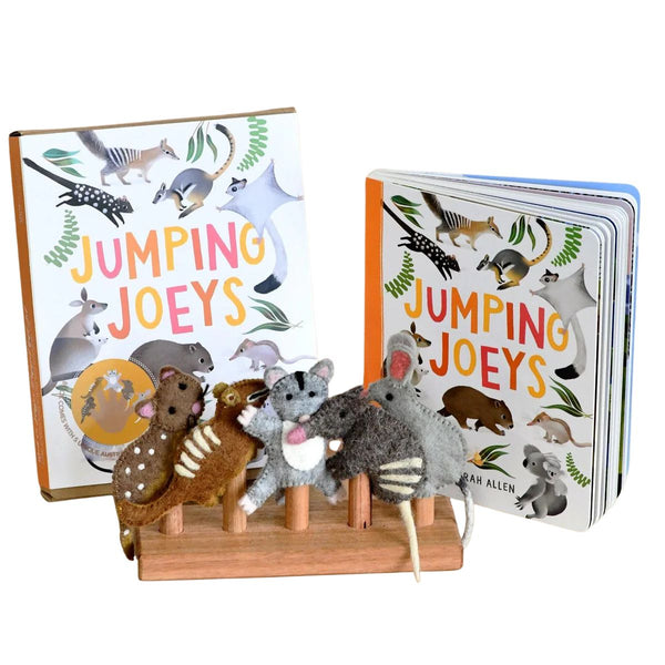 Children's book titled 'Jumping Joeys' & box with felt finger puppet animals on a stand.