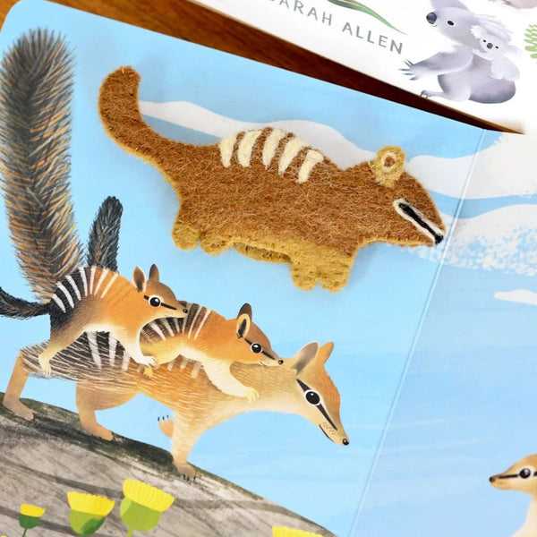 Illustrated book page with numbat illustrations and text, featuring a felt finger puppet numbat.