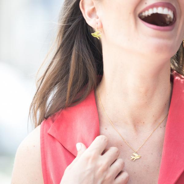 woman wearing Eden Song of Freedom earrings - gold plated bird pendants on gold-plated hooks - Shop Ethical Jewellery & Fair Trade Gifts Melbourne at ONLY JUST 