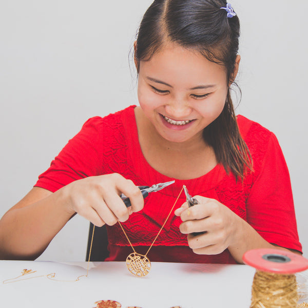 woman making gold pendant and chain necklace - Eden's restoring justice collection - Shop Ethical Jewellery & Fair Trade Gifts Melbourne at ONLY JUST 