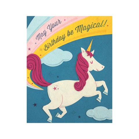 Fair Trade handmade card depicting a white and pink unicorn in front of a rainbow. Message reads "May your birthday be magical!"