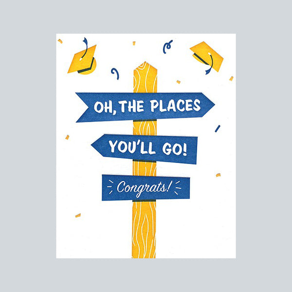 Fair Trade handprinted card with yellow & blue mortar caps and signposts reading "Oh, the places you'll go. Congrats" 