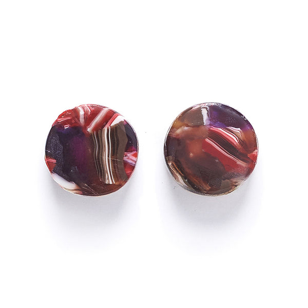 round resin stud earring with purple and pink pattern