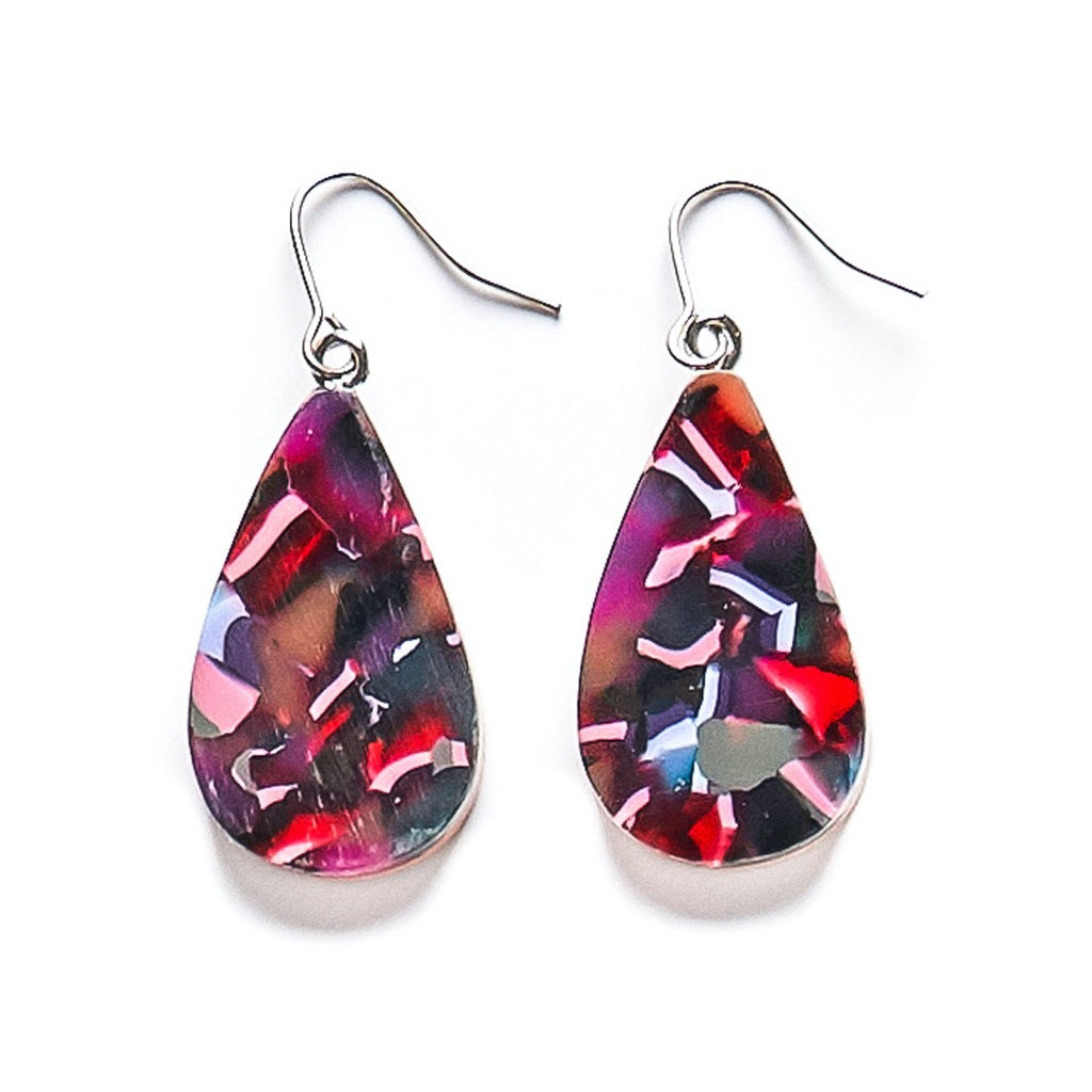 Colourful teardrop resin earrings in abstract navy, purple and pink patterns